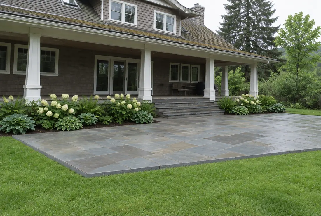 The same Oregon City patio replaced with sawn bluestone and a planted border along the porch